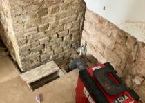 Dehumidifier drying a wall in London
