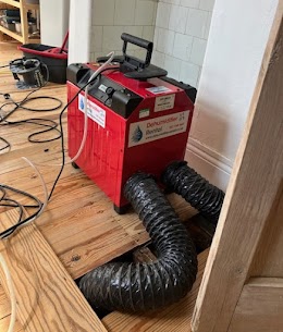 Dehumidifier drying floor in north west London